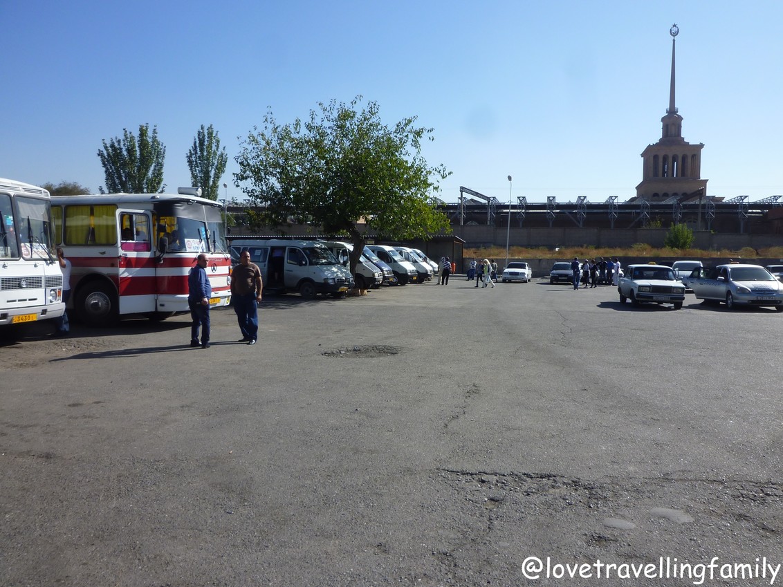 Buses and minibuses at a departure area in Yerevan before the journey south.
