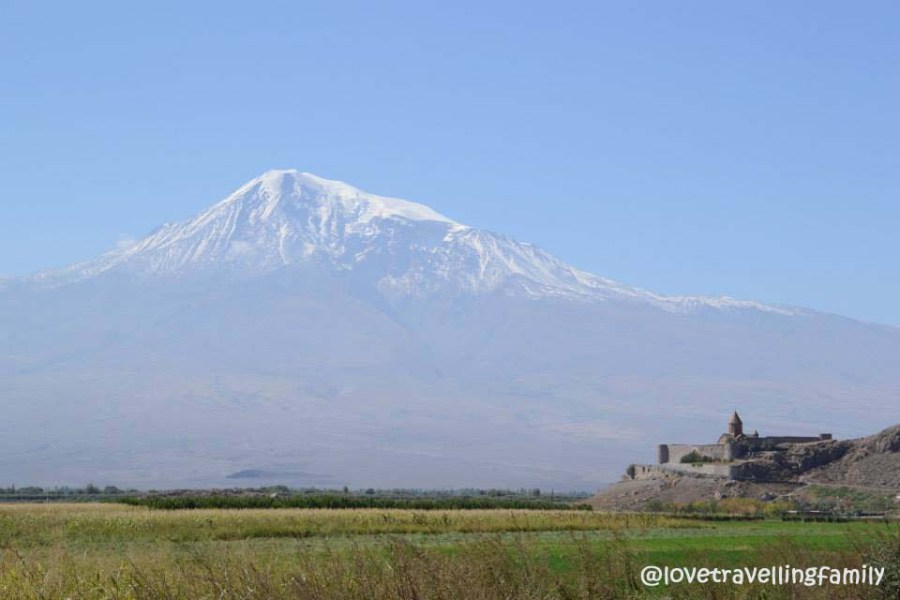 The Khor Virap monastery on a low hill in front of snow-capped Mount Ararat.