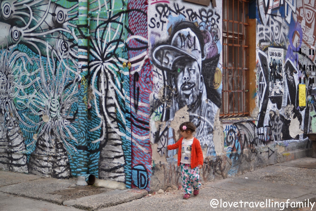 Our family exploring the colourful street art at Metelkova in Ljubljana